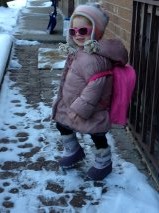 On her way to school! She is obsessed with her shades. 
